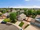 Aerial view of a well-kept home in a Gathering-friendly neighborhood with mature trees and landscaping at 386 Monte Vista St, Brighton, CO 80601