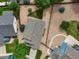 Aerial view showing the home's landscaped yard and proximity to neighboring houses at 386 Monte Vista St, Brighton, CO 80601