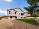 The home has a backyard featuring grass and decorative rock, complete with a porch overlooking the space at 386 Monte Vista St, Brighton, CO 80601