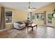 Bright living room with tile flooring and multiple large windows at 386 Monte Vista St, Brighton, CO 80601