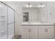 Bathroom with double vanity and a large mirror at 15963 Syracuse St, Thornton, CO 80602