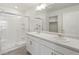 Bathroom with double vanity, shower, and a large mirror at 15963 Syracuse St, Thornton, CO 80602