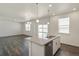 Open concept kitchen with island and dining area at 15963 Syracuse St, Thornton, CO 80602