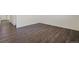Living room with dark gray vinyl plank flooring at 15963 Syracuse St, Thornton, CO 80602