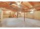 Unfinished basement with exposed ceiling beams and concrete floors at 8204 S Cody St, Littleton, CO 80128