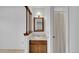 Small bathroom featuring a wood vanity, mirror, and framed shower with curtain at 8204 S Cody St, Littleton, CO 80128