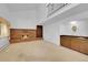 Inviting living room featuring a brick fireplace, built-in shelves and a wet bar at 8204 S Cody St, Littleton, CO 80128