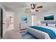 Comfortable bedroom with neutral tones, a ceiling fan, and views to the hallway at 4038 S Richfield Way, Aurora, CO 80013