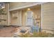 Inviting townhome entrance featuring a decorative door, enhanced lighting, and neat landscaping for a charming welcome at 4038 S Richfield Way, Aurora, CO 80013