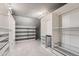 Spacious walk-in closet with ample storage options, shelving, and lighting at 4038 S Richfield Way, Aurora, CO 80013