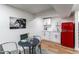 Basement kitchenette area with red retro refrigerator, cabinets, and counter space at 7444 W 81St Ave, Arvada, CO 80003