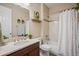 Clean bathroom with a shower over tub, vanity with a mirror, and decor at 18067 E Anthem Dr, Parker, CO 80134