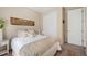 Well-lit guest bedroom features a comfortable bed, side table, closet, and inviting decor at 18067 E Anthem Dr, Parker, CO 80134