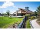 Community clubhouse showcasing modern architecture, lush landscaping, and inviting outdoor spaces at 18067 E Anthem Dr, Parker, CO 80134