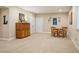 Cozy dining area with wooden table and chairs adjacent to the basement living room at 18067 E Anthem Dr, Parker, CO 80134