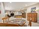Basement dining area featuring wooden table set and decor, next to living room at 18067 E Anthem Dr, Parker, CO 80134