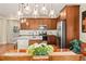 Bright kitchen with a view of the dining area featuring granite countertops, stainless steel appliances, and stylish pendant lighting at 18067 E Anthem Dr, Parker, CO 80134