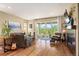 Bright and airy living room with sliding glass doors, modern fireplace, and hardwood floors at 18067 E Anthem Dr, Parker, CO 80134