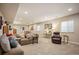 Comfortable living room with cozy couch, side tables, chair and natural lighting at 18067 E Anthem Dr, Parker, CO 80134