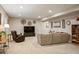 Spacious carpeted living room featuring a comfortable sectional sofa, recliner, and stylish decor at 18067 E Anthem Dr, Parker, CO 80134