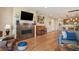 Cozy living space featuring a fireplace, musical instruments, and adjacent to the kitchen area at 18067 E Anthem Dr, Parker, CO 80134