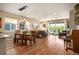 Open floor plan with dining area, living space and sliding glass doors to an outdoor patio at 18067 E Anthem Dr, Parker, CO 80134