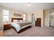 Spacious main bedroom with a king bed, large windows, and en-suite bathroom provides a relaxing retreat at 18067 E Anthem Dr, Parker, CO 80134