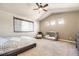 Inviting bedroom with a vaulted ceiling, neutral colors, a king sized bed, and a crib at 16534 E Fire Fly Ave, Parker, CO 80134