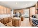 Spacious kitchen features an island, stainless steel appliances, and a bright, open layout at 16534 E Fire Fly Ave, Parker, CO 80134