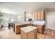 Open kitchen with an island, granite countertops, and stainless steel appliances with seamless layout at 16534 E Fire Fly Ave, Parker, CO 80134