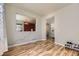 Open living room with wood-look floors, and decorative pass-through to the adjacent rooms at 16534 E Fire Fly Ave, Parker, CO 80134