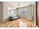 Inviting living room features wood-look flooring, accent furniture, and an open, airy feel at 16534 E Fire Fly Ave, Parker, CO 80134