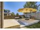 Outdoor patio area perfect for summer BBQs, with a grill, shade umbrella, and outdoor seating at 16534 E Fire Fly Ave, Parker, CO 80134