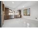 Basement bar with modern appliances, ample cabinetry, and recessed lighting at 15218 W La Salle Ave, Lakewood, CO 80228