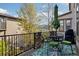 Outdoor deck with patio furniture, umbrella, and a lovely neighborhood view at 15218 W La Salle Ave, Lakewood, CO 80228