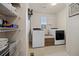 Convenient laundry room with modern washer/dryer units and ample shelving for storage at 15218 W La Salle Ave, Lakewood, CO 80228