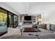 Cozy living room featuring a fireplace, large sectional sofa and sliding doors to the outside at 15218 W La Salle Ave, Lakewood, CO 80228