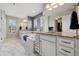Bright and spacious main bathroom features double vanities, a soaking tub, and neutral decor at 15218 W La Salle Ave, Lakewood, CO 80228