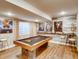 Finished basement recreation area with a pool table and bar area at 4616 Girardot Pt, Castle Rock, CO 80104