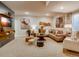 Finished basement with sectional sofa, accent chairs, and a large TV at 4616 Girardot Pt, Castle Rock, CO 80104