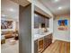 Basement wet bar with dark gray cabinets and quartz countertop at 4616 Girardot Pt, Castle Rock, CO 80104