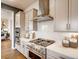 Modern kitchen with stainless steel appliances and marble backsplash at 4616 Girardot Pt, Castle Rock, CO 80104