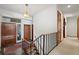 Entryway featuring slate floors, wood doors, and a staircase to the upper level of the home at 9142 Warriors Mark Dr, Franktown, CO 80116