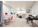 Bright basement with a desk, shelves, toys, and piano offering versatile space for creative play and hobbies at 13560 Detroit St, Thornton, CO 80241