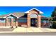 Exterior view of the 'Signal Creek' community building with brick facade at 13560 Detroit St, Thornton, CO 80241