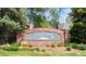 Entrance to Signal Creek Community with brick signage surrounded by beautiful landscaping at 13560 Detroit St, Thornton, CO 80241