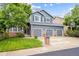 Charming two-story home with a three-car garage and a well-maintained lawn at 13560 Detroit St, Thornton, CO 80241