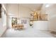 Open-concept living area with hardwood floors and a staircase leading to the upper level at 13560 Detroit St, Thornton, CO 80241
