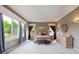 Serene main bedroom with large windows and natural light offers a peaceful retreat with stylish decor at 13560 Detroit St, Thornton, CO 80241