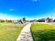Well-maintained playground with vibrant equipment set against lush green landscape at 13560 Detroit St, Thornton, CO 80241